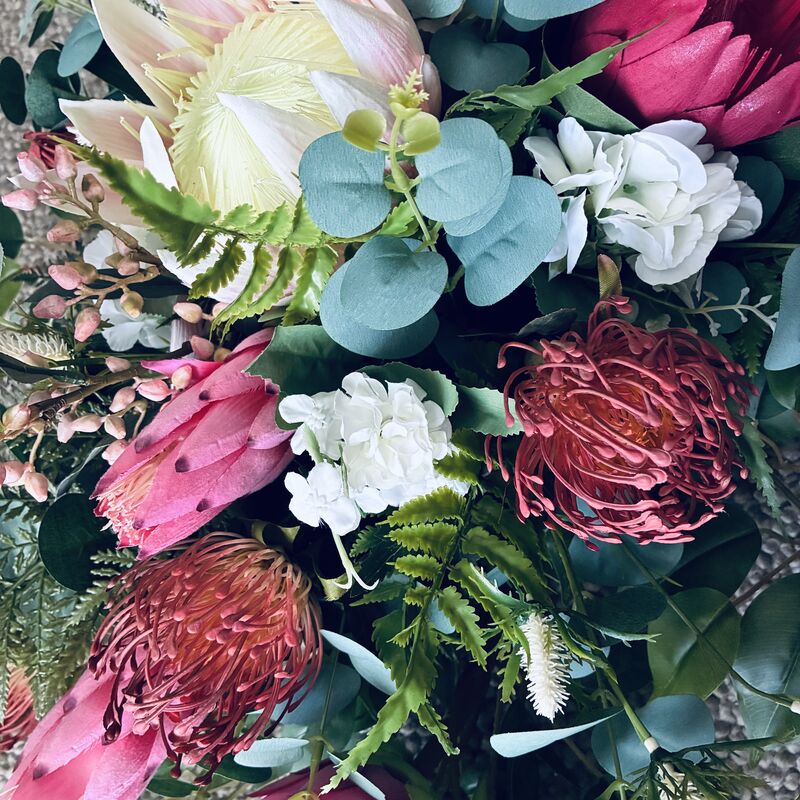 Arbour Flowers   Natives   Mix of pinks red and foliage 
