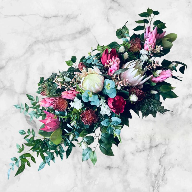 Arbour Flowers   Natives   Mix of pinks red and foliage 