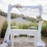 Arbour, Signing Table, chairs, Drapes, Flowers 