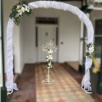 White Metal Arch, Drapes, Arbour Flowers 